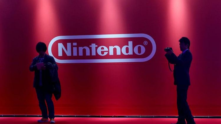 NINTENDO-RESULTS:Nintendo trims annual profit outlook on firmer yen