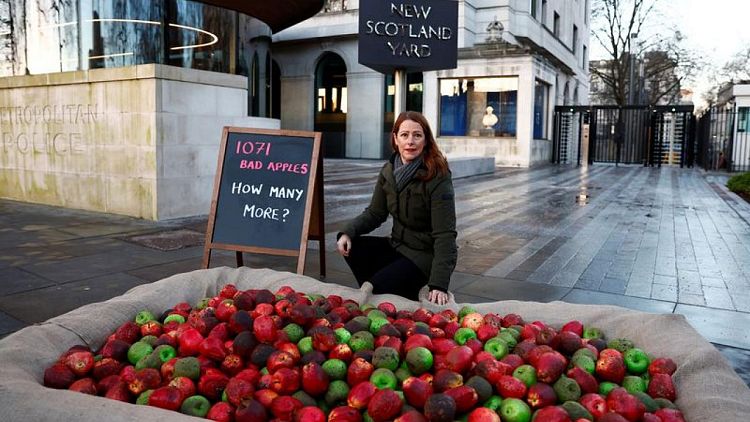 One thousand 'bad apples' placed outside London police HQ in demonstration