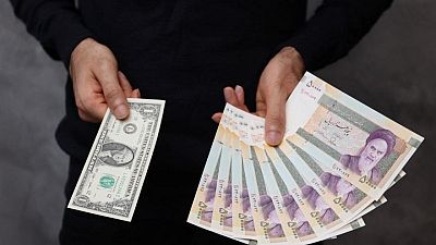 Iranian currency falls to record low amid isolation and sanctions