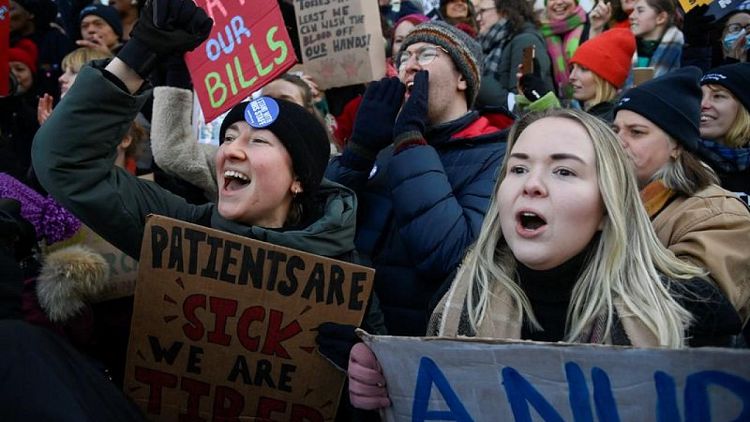 BRITAIN-STRIKES-NURSES:Some UK health workers call off strikes after receiving pay offers